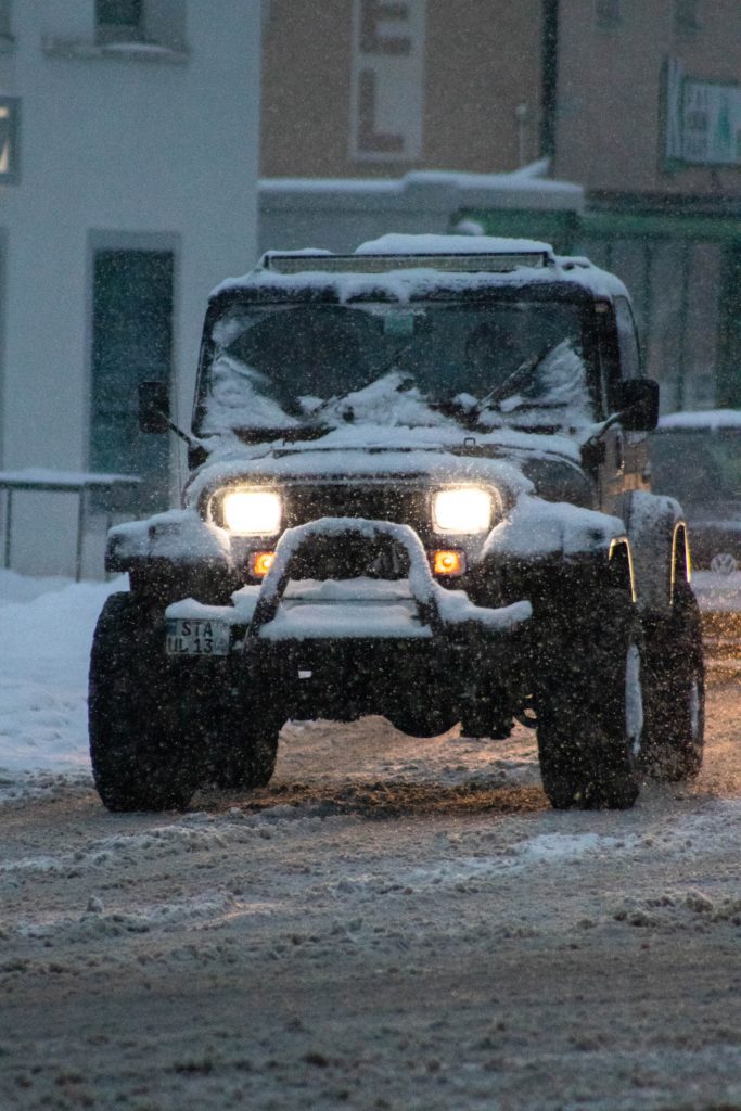 Jeep on a snowy street, Here's Why You Shouldn't Warm Up Your Car in the Winter