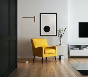 Yellow chair against a cream colored wall, home staging, real estate