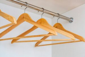 wooden hangers in a closet, organization,
